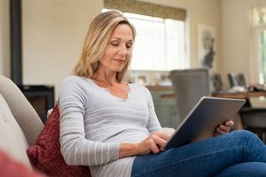 Woman using a tablet to browse the web