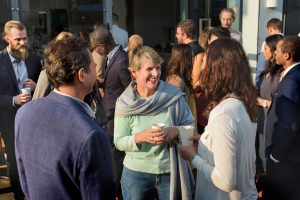 Group of people smiling and chatting